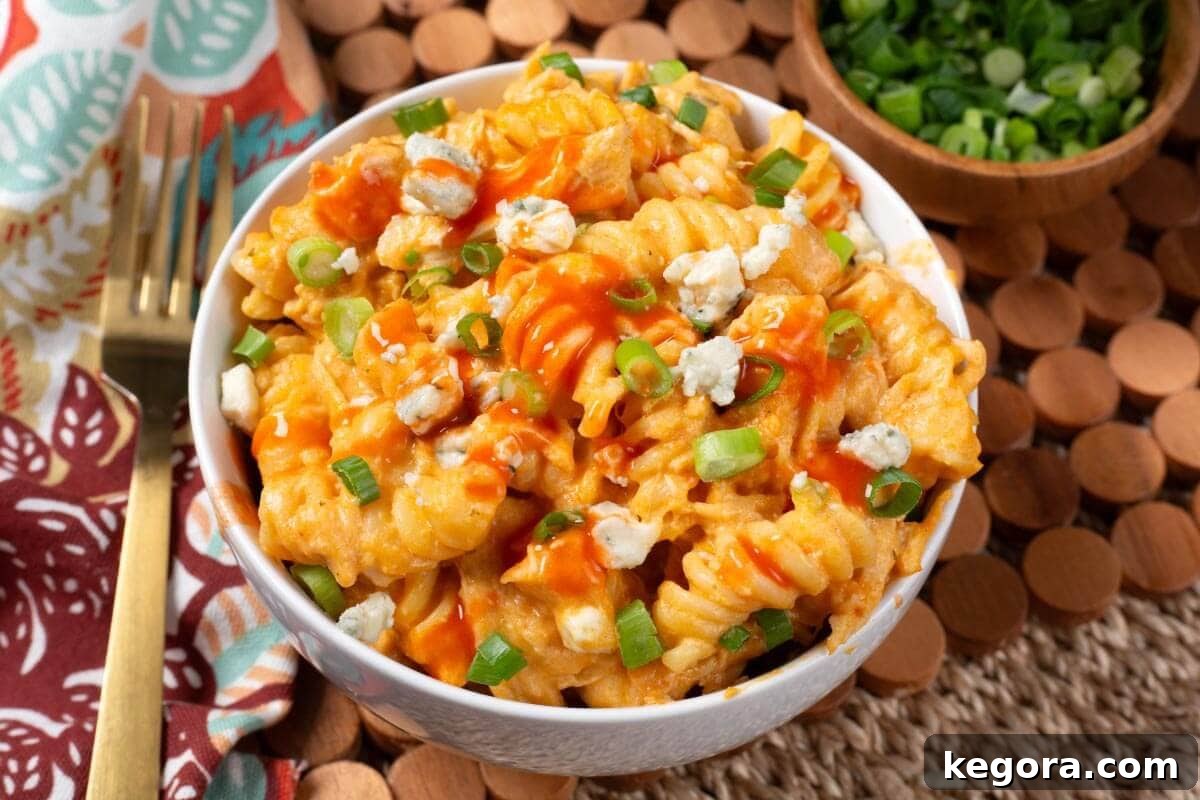 Close-up of a serving of Crockpot Buffalo Chicken Mac and Cheese, showcasing its creamy texture