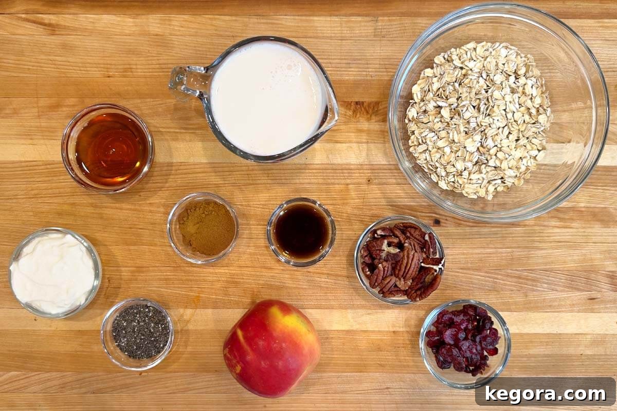 Spiced Apple Overnight Oats 4 Apple Overnight Oatmeal ingredients shot on a board