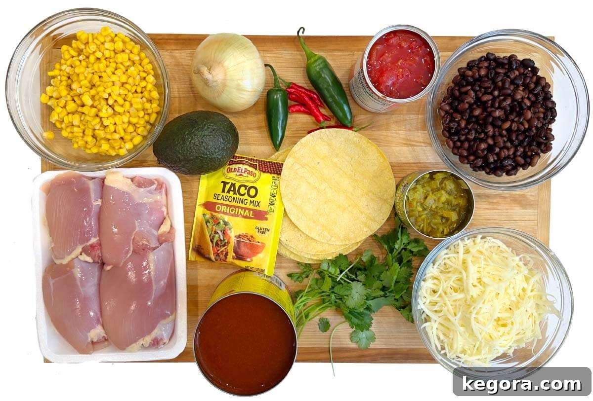 Slow Cooker Cheesy Chicken Enchilada Bake 4 Crockpot Chicken Enchilada Casserole ingredients laid out on a board