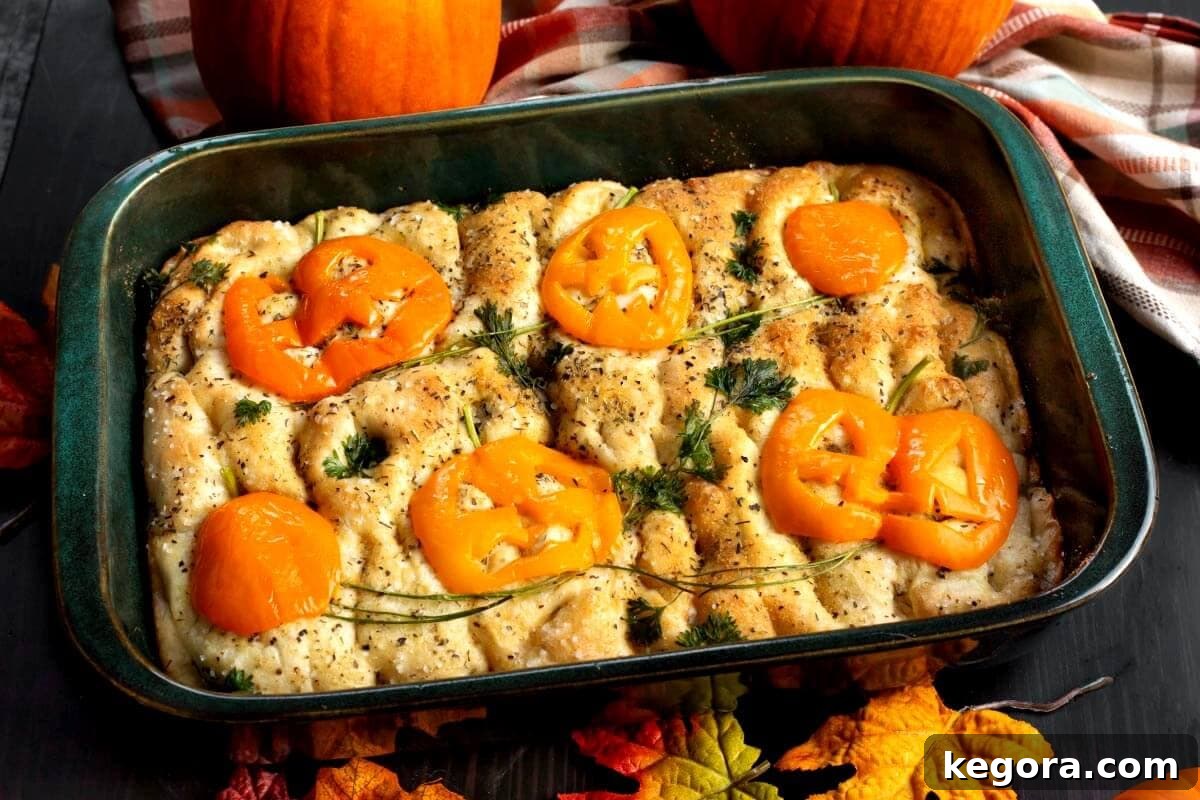 Halloween Focaccia Bread with various vegetable decorations