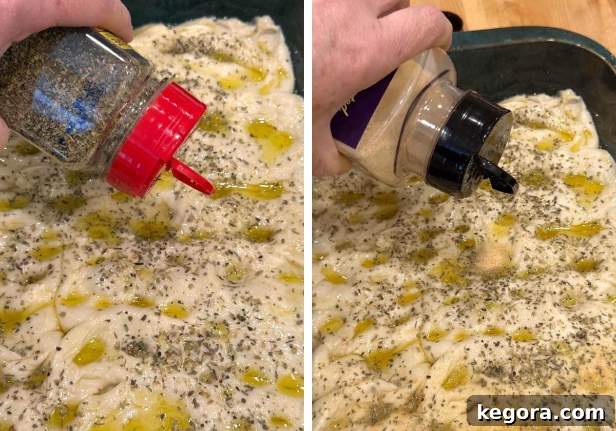 Seasoning focaccia dough with Italian seasoning and garlic powder