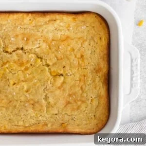 Creamy gluten-free corn casserole in a rustic baking dish.