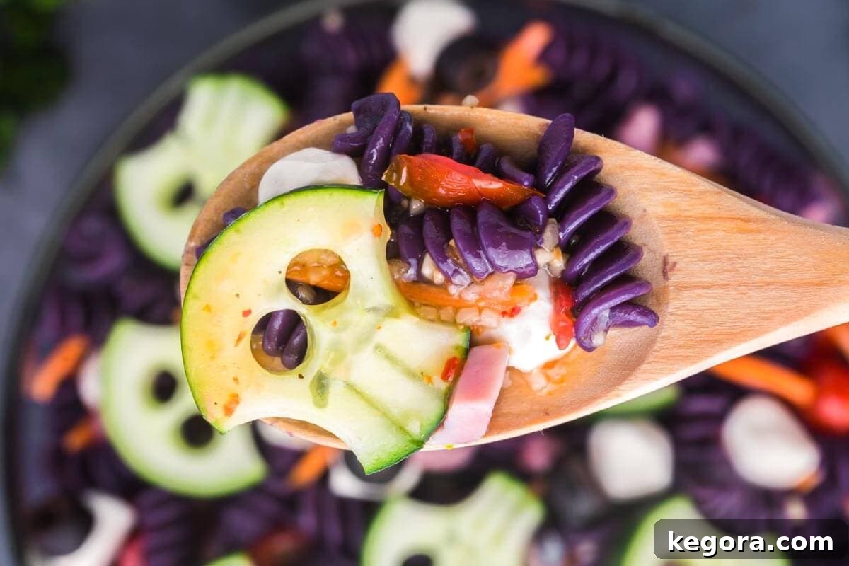 Purple Skull Halloween pasta salad decorated with cucumber skulls