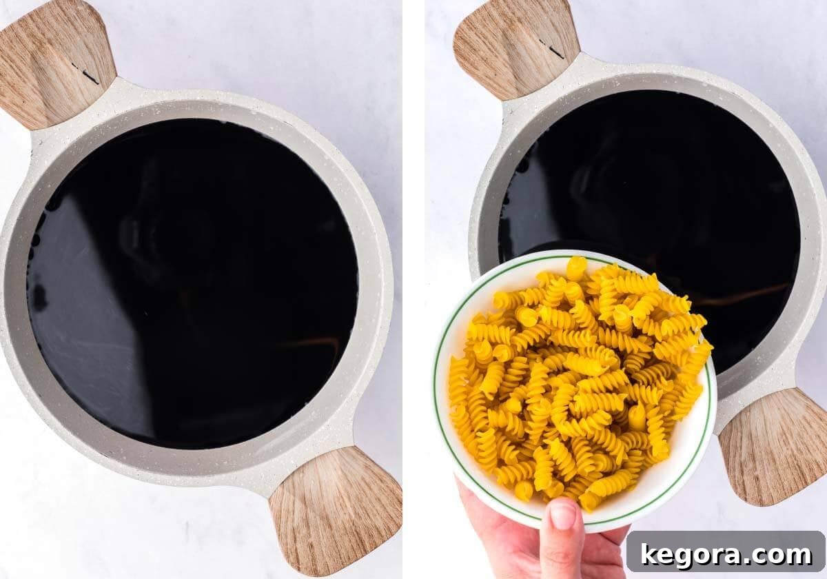 adding pasta to colored water to cook and get dyed