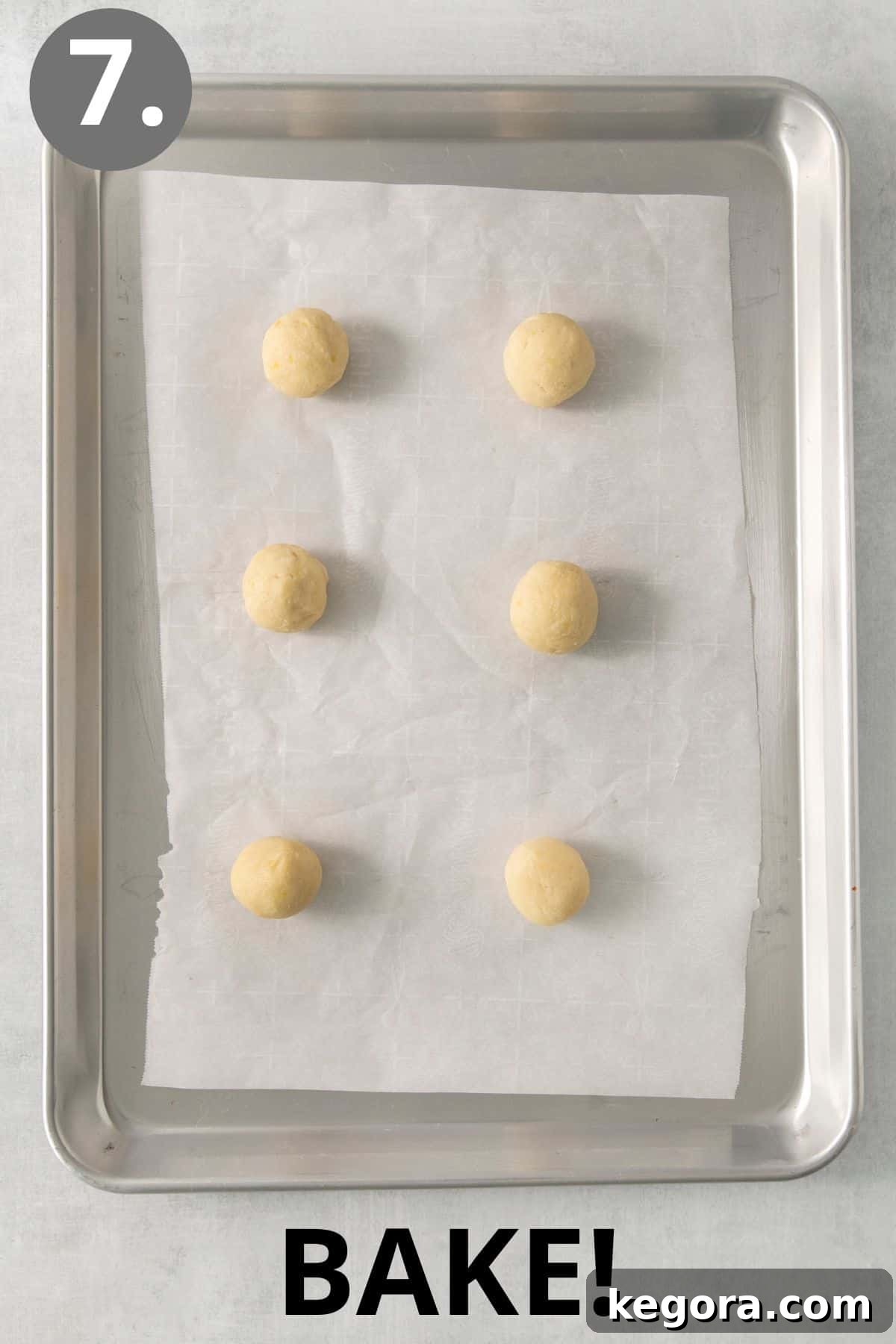 Zesty Lemon Gluten-Free Delights 11 Lemon cookie dough balls on a baking sheet