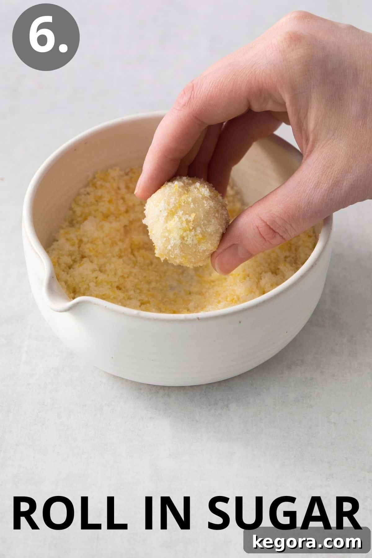 Zesty Lemon Gluten-Free Delights 10 Lemon cookie dough ball rolled being rolled in a bowl of sugar
