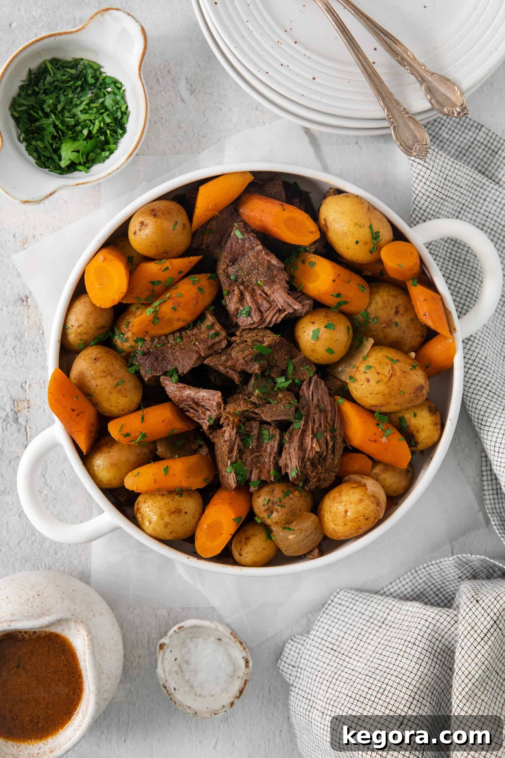 Sirloin roast with carrots and potatoes in a baking dish, ready to serve