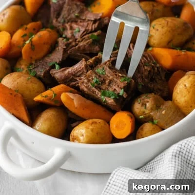 Sirloin roast with carrots and potatoes in a baking dish