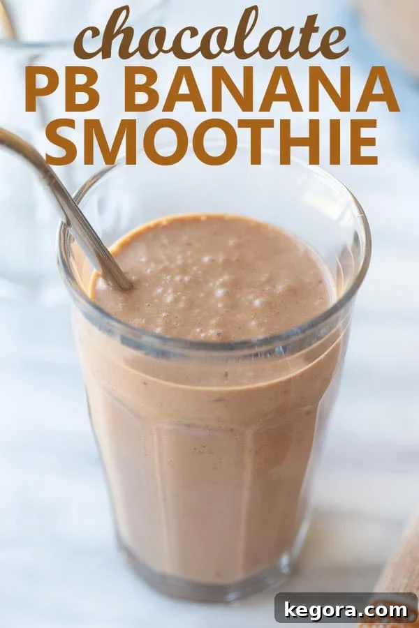 Choco-PB Banana Dream 3 A vibrant and creamy peanut butter banana smoothie served in a stylish glass cup, inviting you to take a refreshing sip.
