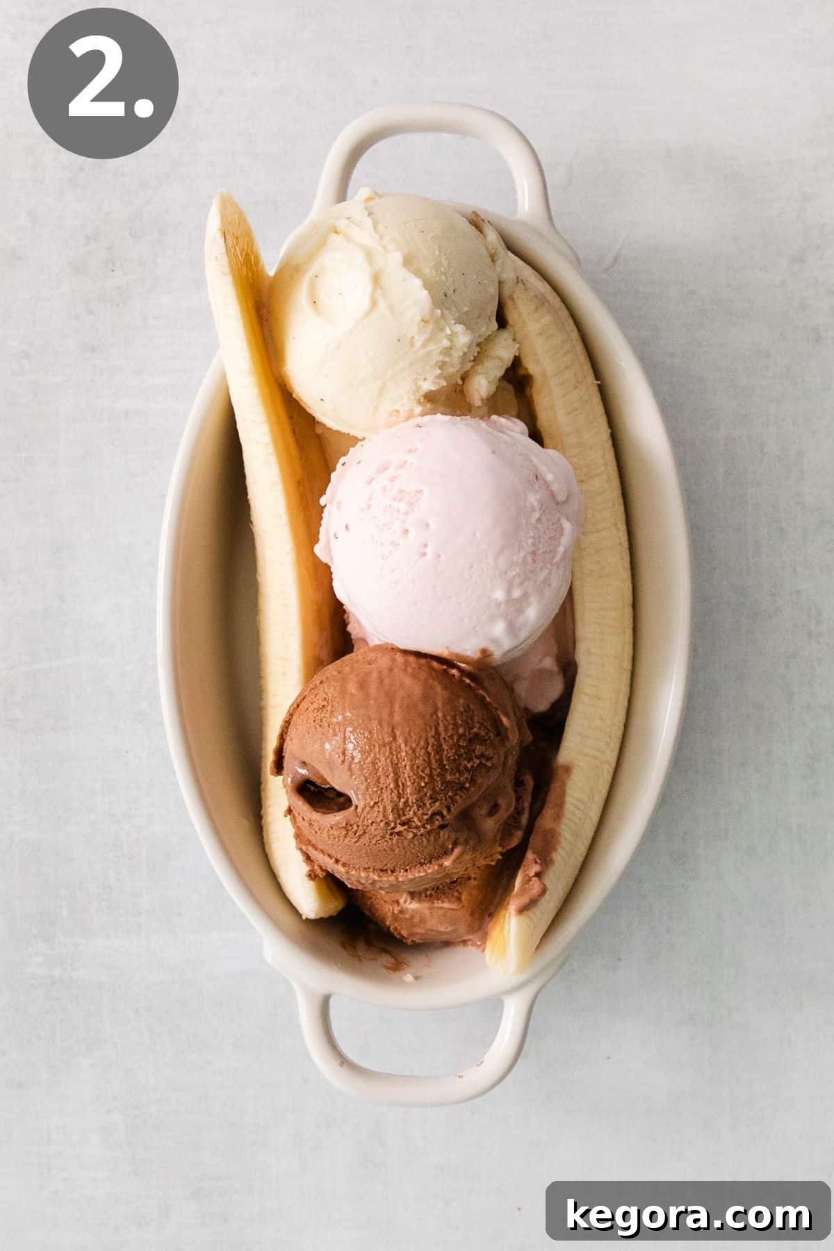 Timeless Banana Split Indulgence 5 Three ice cream scoops and banana slices in a dish