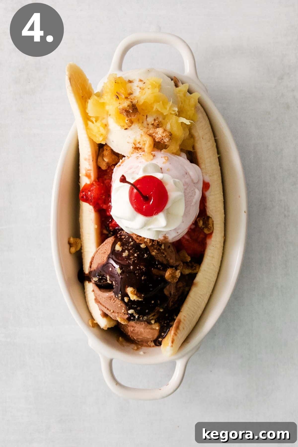 Timeless Banana Split Indulgence 7 Banana split in a dish with a cherry on top