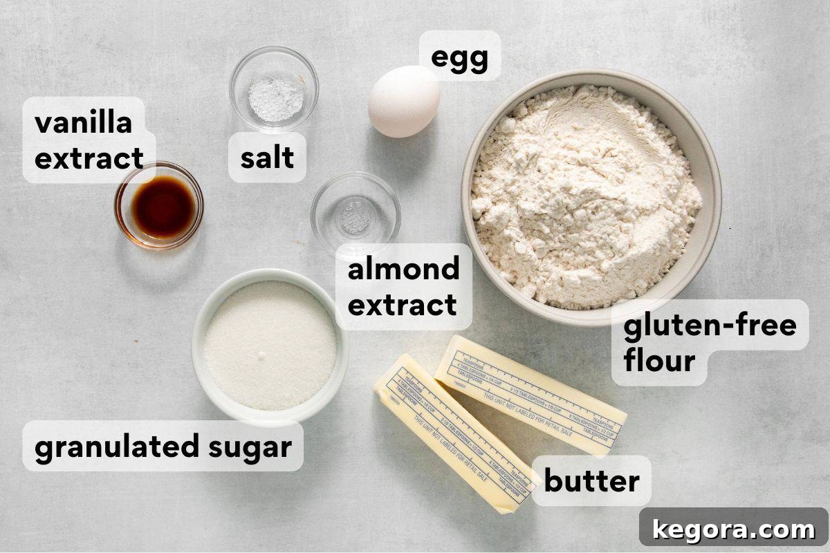 Carefully measured and labeled ingredients for gluten-free spritz cookies, ready for mixing.