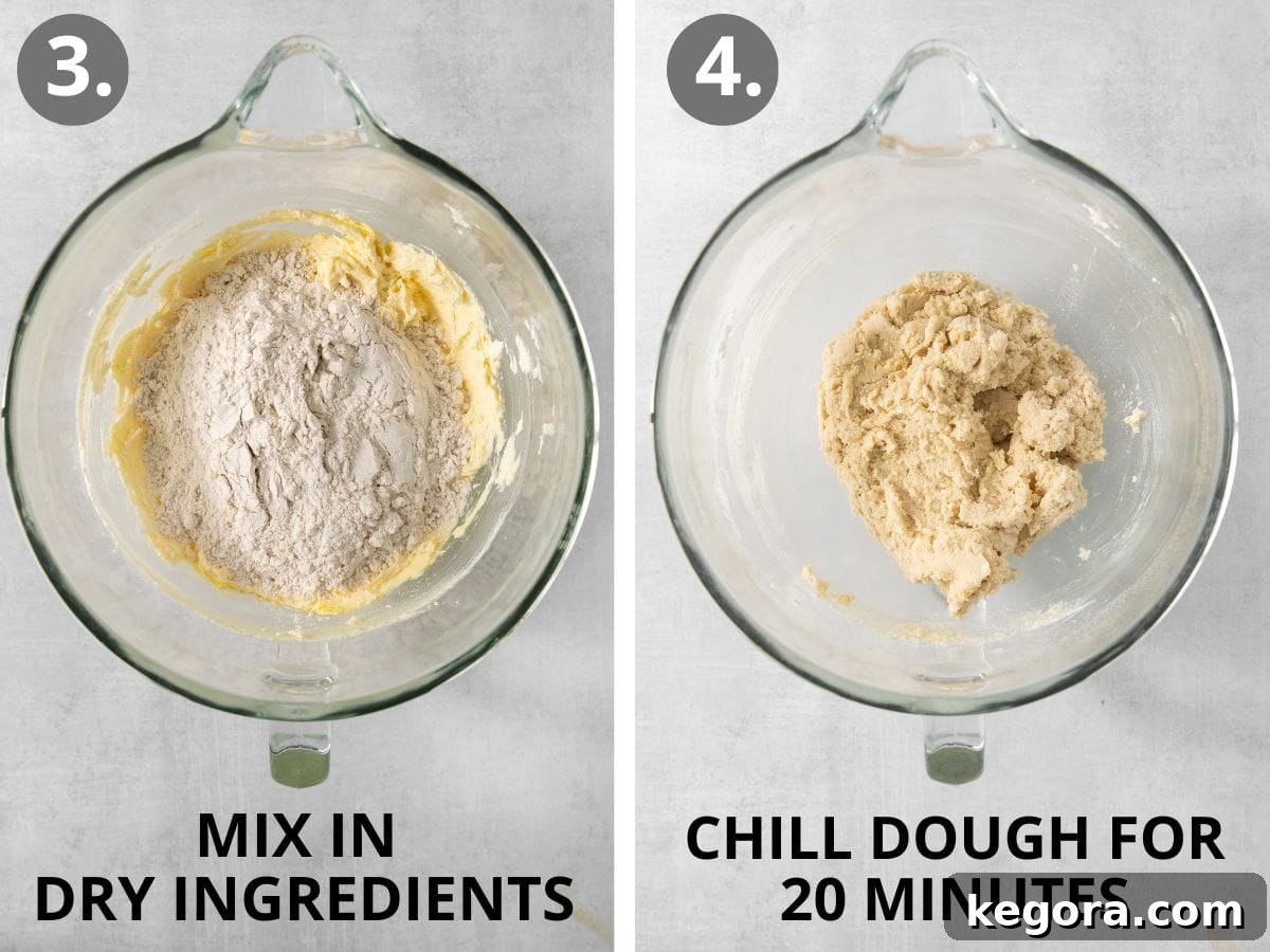 Gluten-free spritz cookie dough, after dry ingredients are mixed into wet, showcased in a glass mixing bowl.