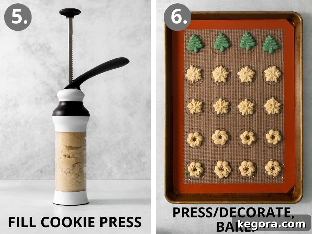 A cookie press filled with dough, actively shaping gluten-free spritz cookies onto a baking sheet, displaying various designs.