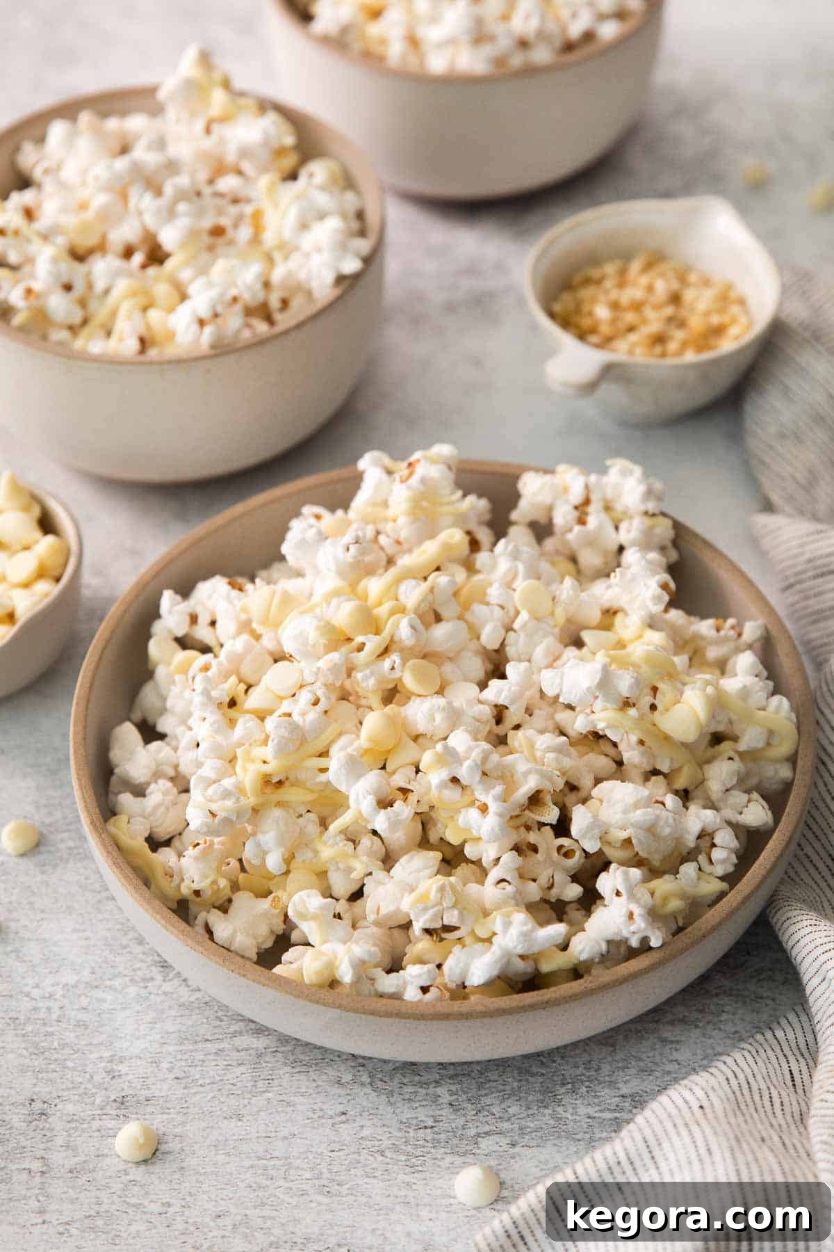 Gourmet White Chocolate Pop 2 White chocolate popcorn in a bowl, ready to be enjoyed