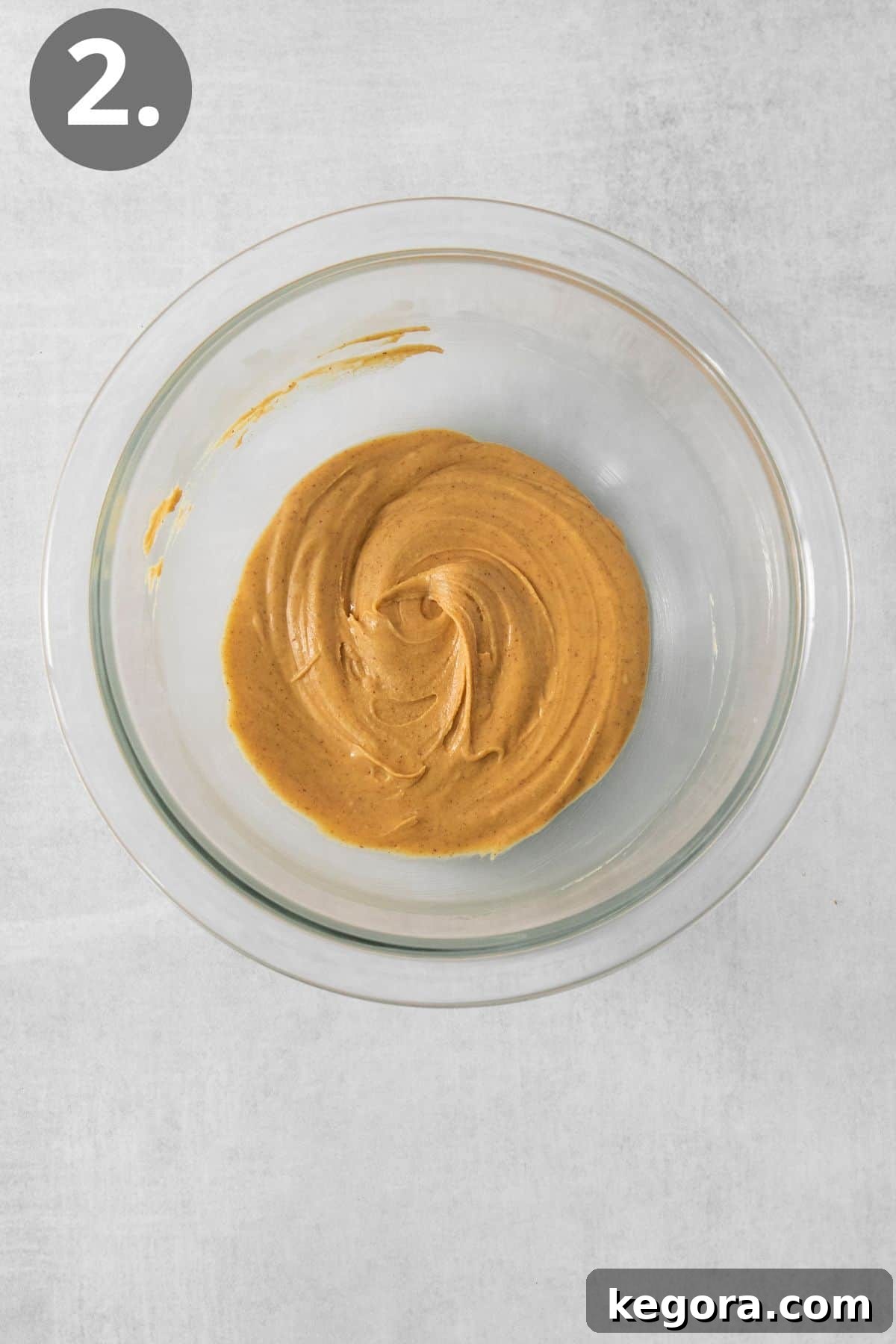 Nutty Caramel Popcorn 5 Melted peanut butter chips in a small mixing bowl