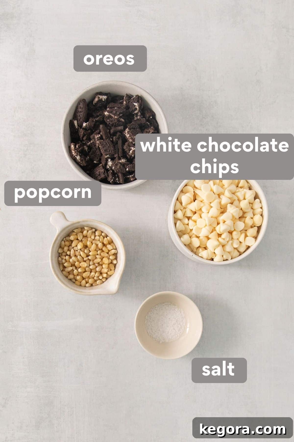 Cookies and Cream Popcorn 3 All the necessary ingredients for making Oreo popcorn neatly arranged on a kitchen countertop.