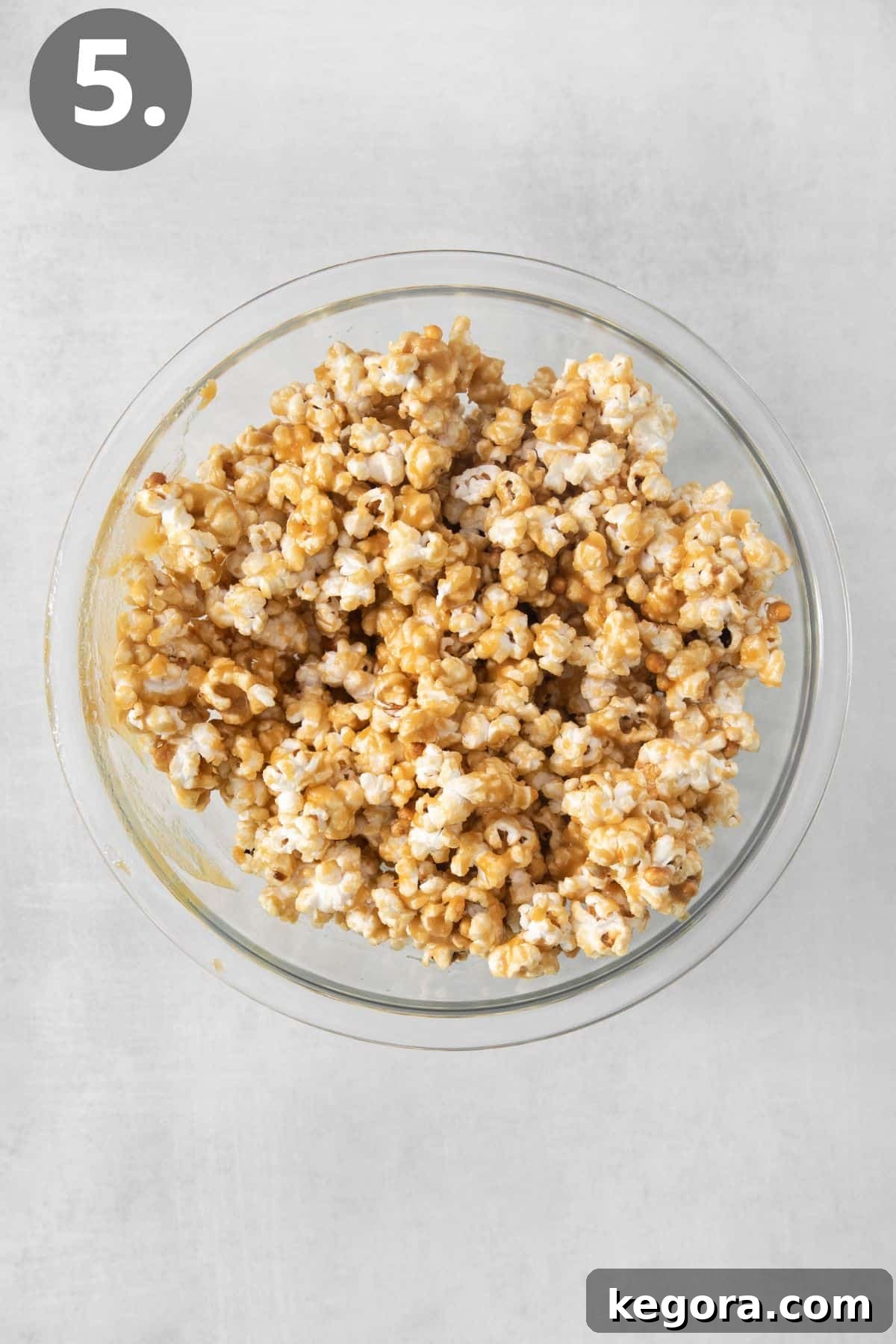 Effortless Caramel Popcorn Treat 8 Microwave caramel corn in a bowl on a countertop