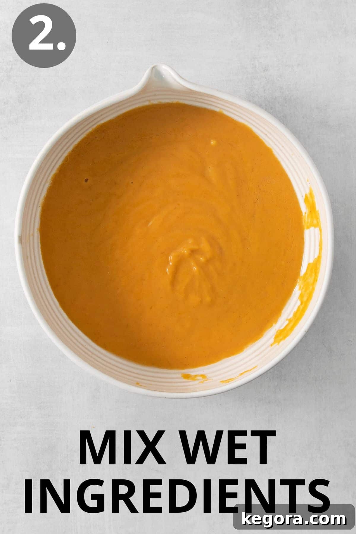 Cozy Gluten-Free Pumpkin Spice Loaf 6 Wet ingredients for gluten-free pumpkin bread in a bowl