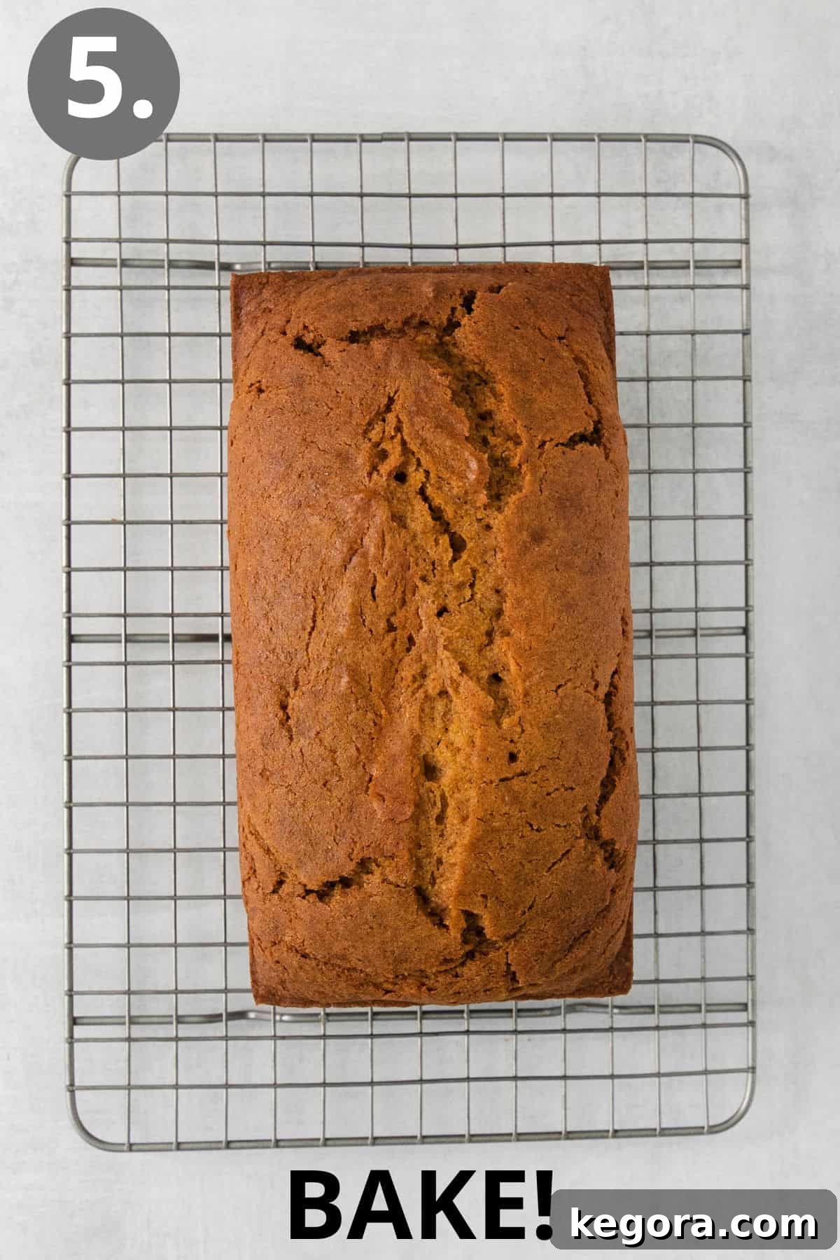 Cozy Gluten-Free Pumpkin Spice Loaf 9 Baked gluten-free pumpkin bread on a wire cooling rack