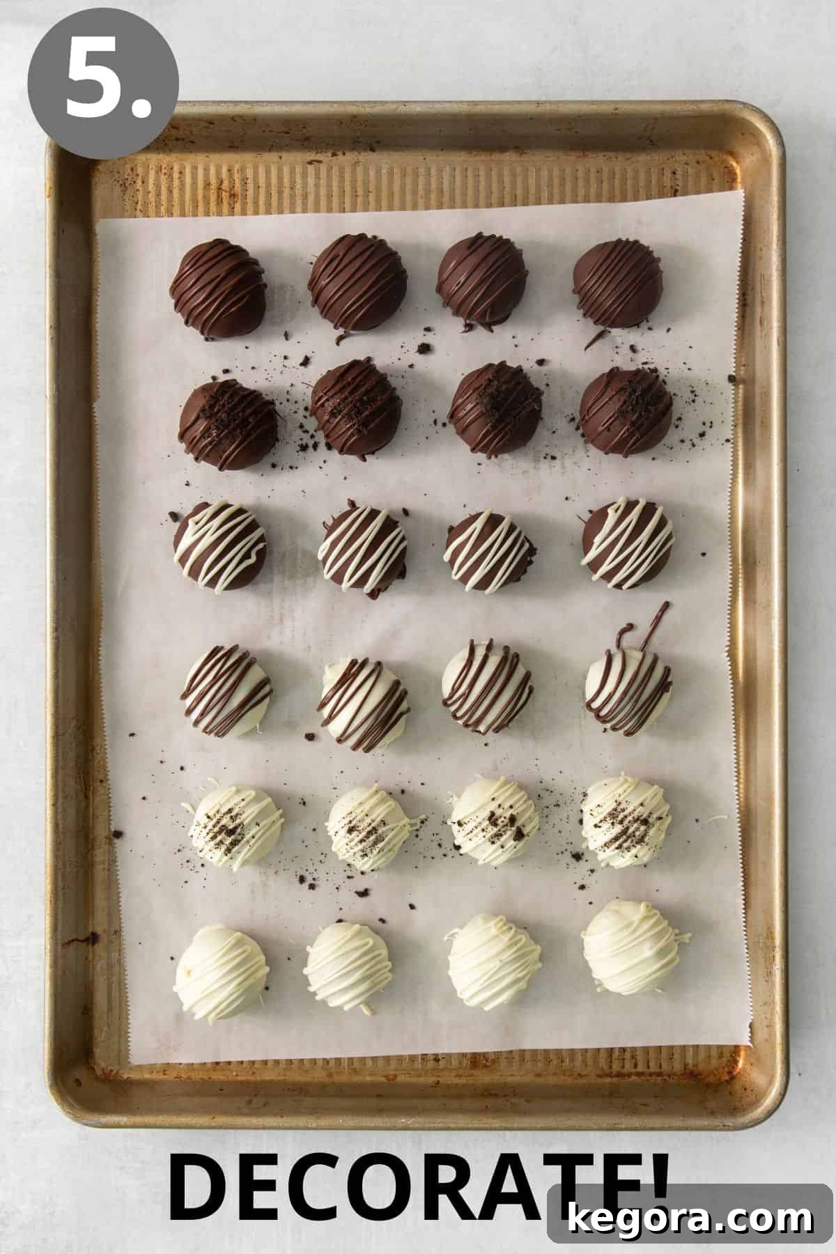 Gluten-Free Oreo Dream Bites 6 An array of gluten-free Oreo truffles, half dipped in dark chocolate and half in white chocolate, neatly arranged on a baking sheet, with some decorated.