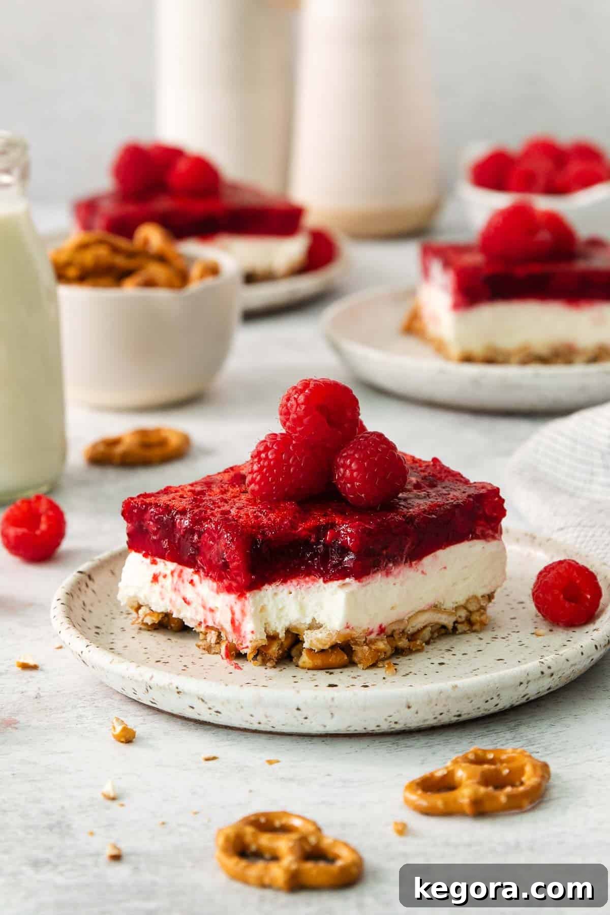 A serving of raspberry pretzel salad on a plate