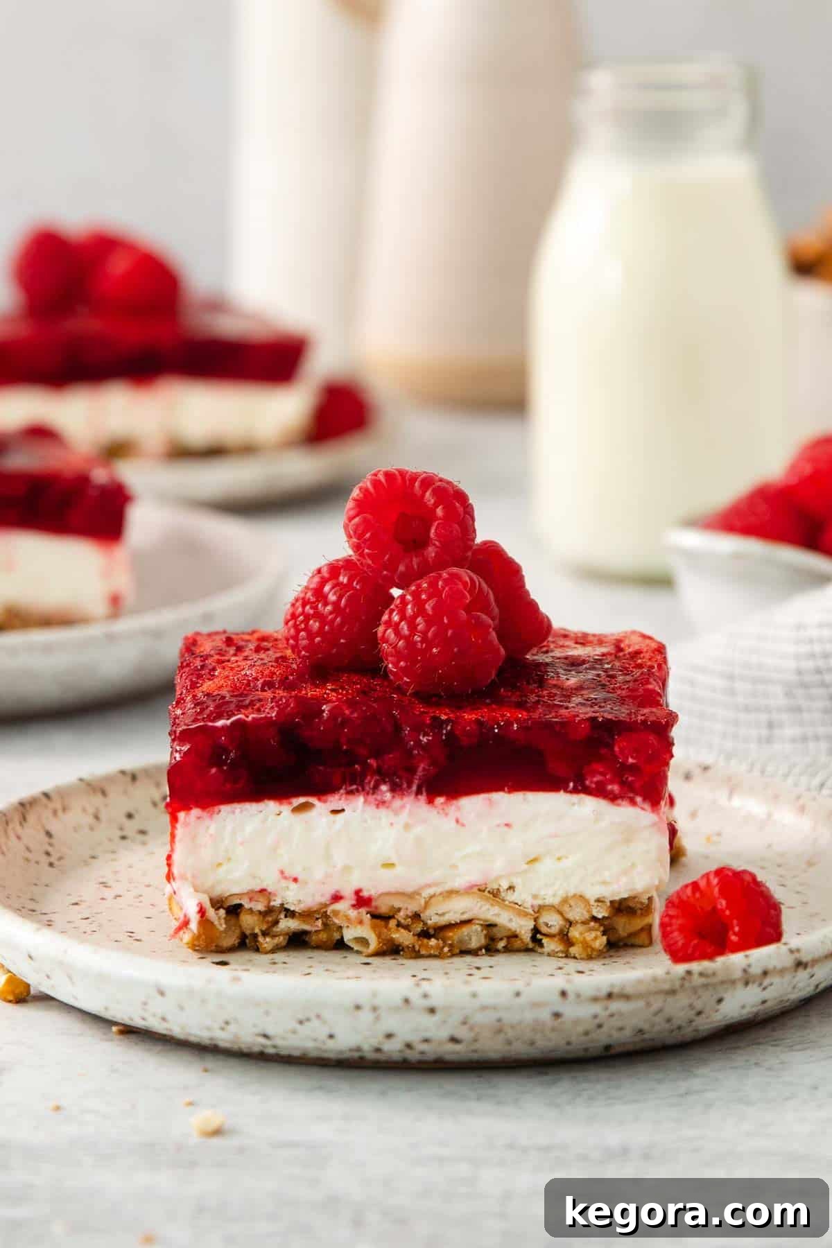 A serving of raspberry pretzel salad on a plate
