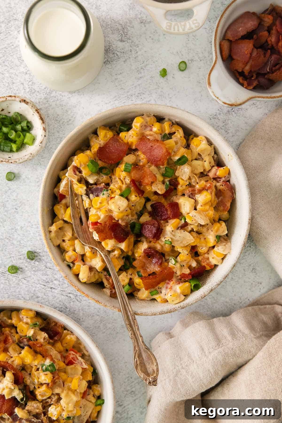 Cream cheese corn in a bowl with a fork