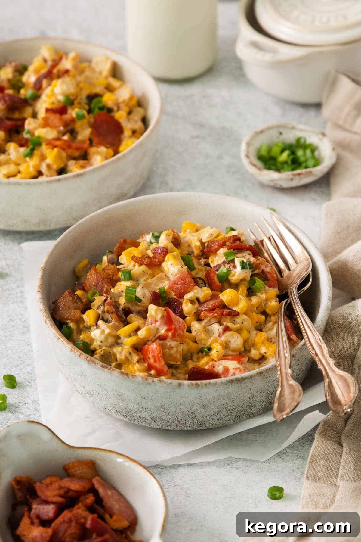Cream cheese corn in a bowl with a fork