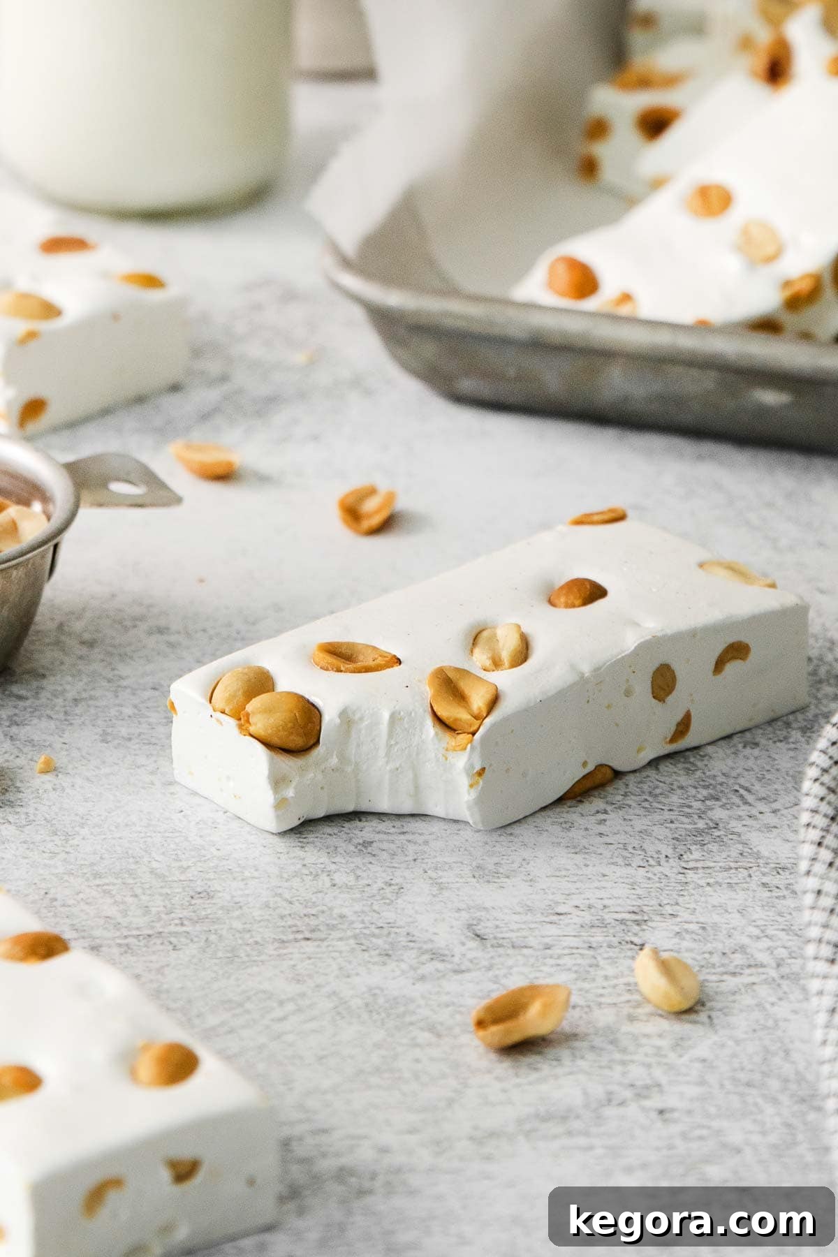 Crafting Irresistible Nougat 8 Delicious nougat pieces neatly arranged on parchment paper, showcasing their soft, appealing texture.