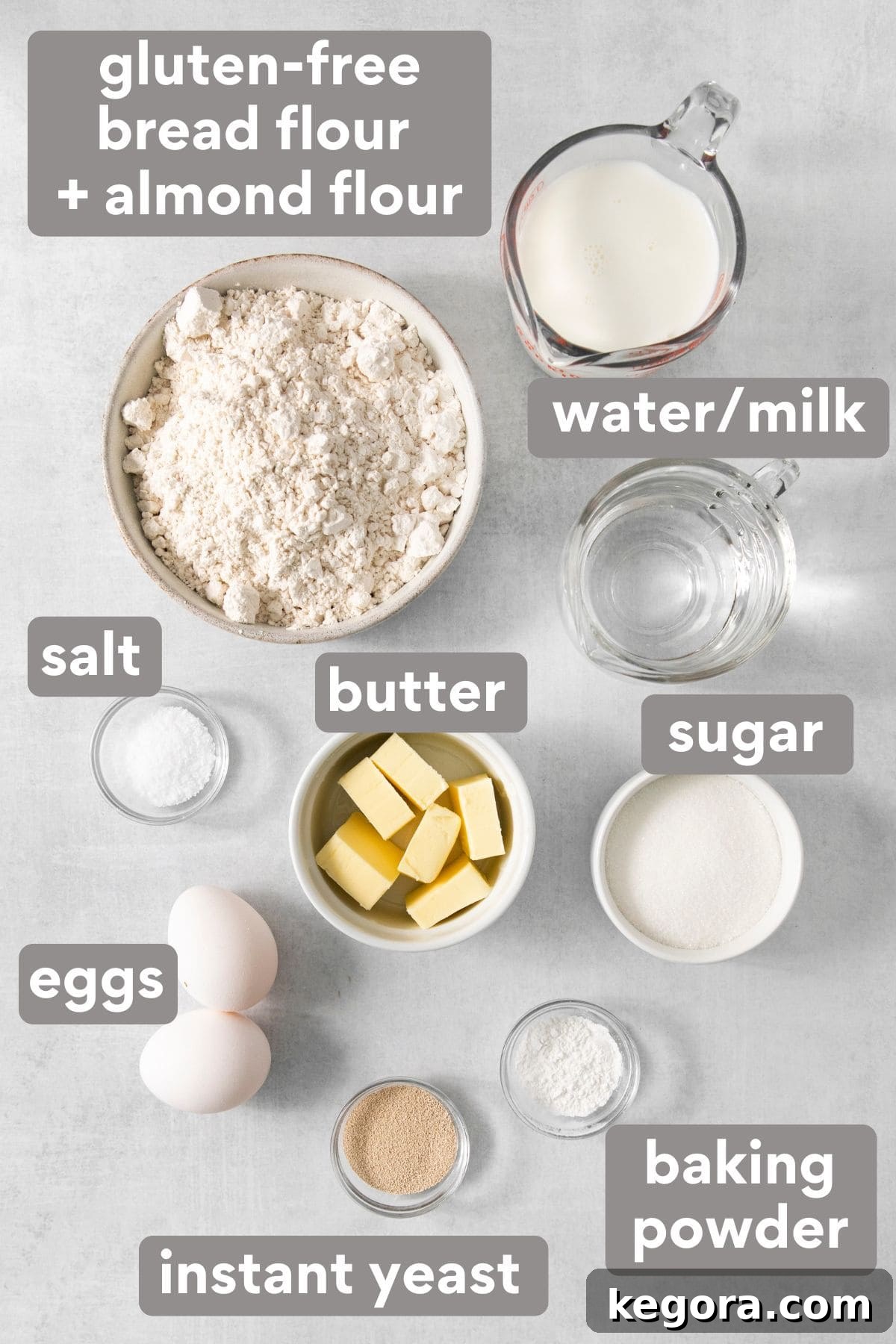 Scrumptious Gluten Free Crescent Rolls 3 A collection of ingredients for gluten-free crescent rolls, including various flours, sugar, butter, and yeast, neatly arranged on a kitchen countertop.