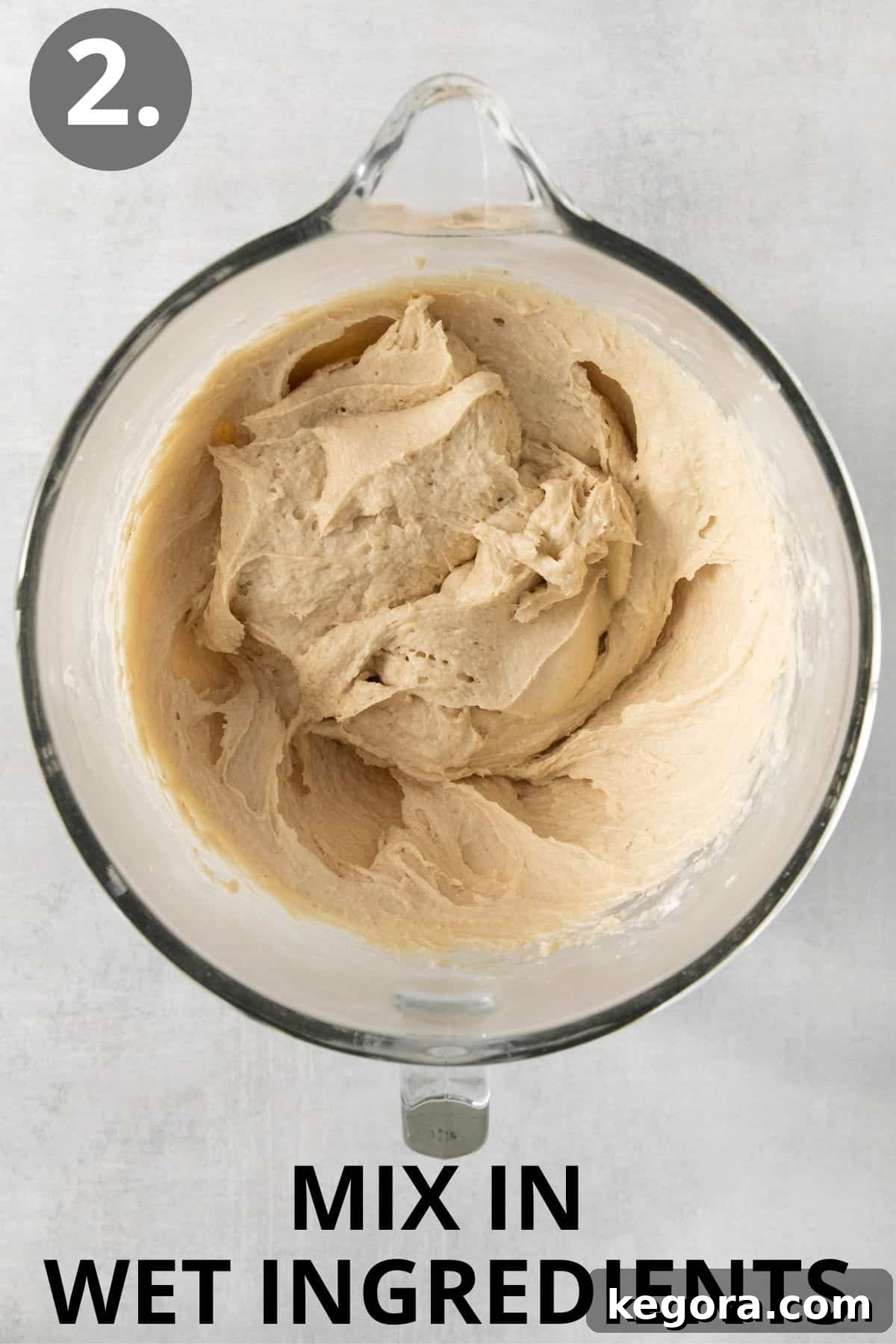 Scrumptious Gluten Free Crescent Rolls 6 Wet and dry ingredients for gluten-free crescent rolls are combined in a glass bowl, forming a thick dough.