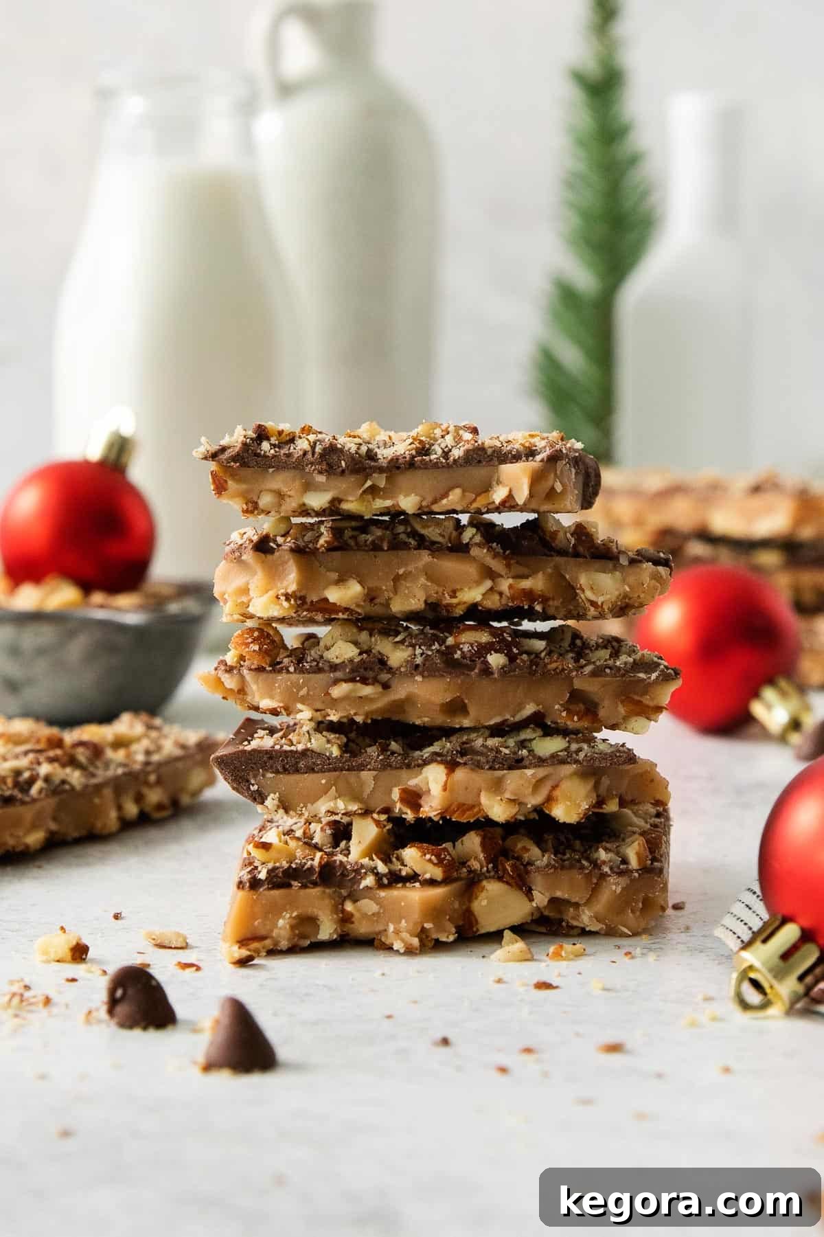 Stack of freshly made English toffee pieces on a kitchen counter, ready to be enjoyed.