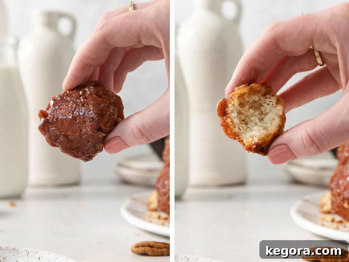 Delectable Gluten-Free Pull-Apart Bread 7 Two hands, one holding a freshly baked gluten-free monkey bread ball, and another holding a larger piece of monkey bread with a bite taken out, highlighting its fluffy texture.