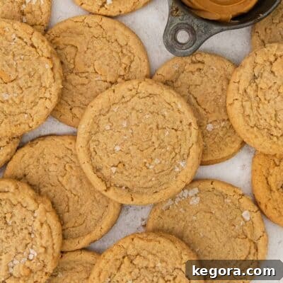 A delicious close-up of soft, chewy gluten-free peanut butter cookies on a counter, freshly baked and ready to eat.