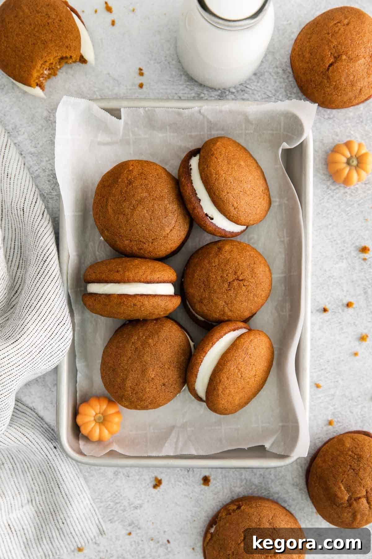 Pumpkin Spice Dreams: Gluten-Free Whoopie Pies 2 An overhead view of gluten-free pumpkin whoopie pies in a baking dish, showcasing their rich color and inviting texture.