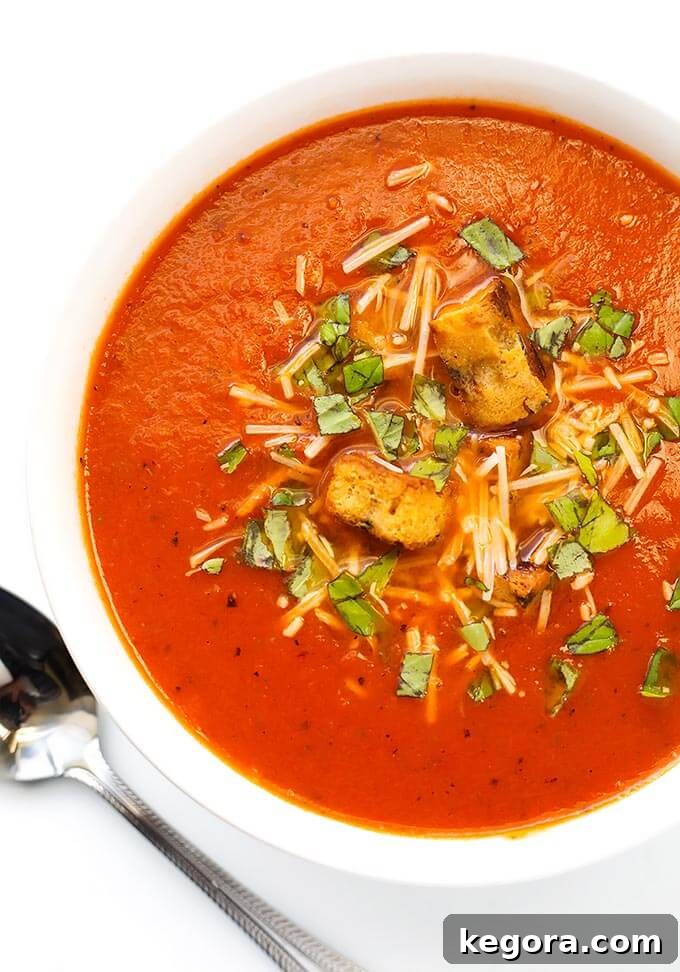 15 Instant Pot Hacks for Effortless Cooking 21 Instant Pot Easy Tomato Soup in a white bowl on white background with silver spoon