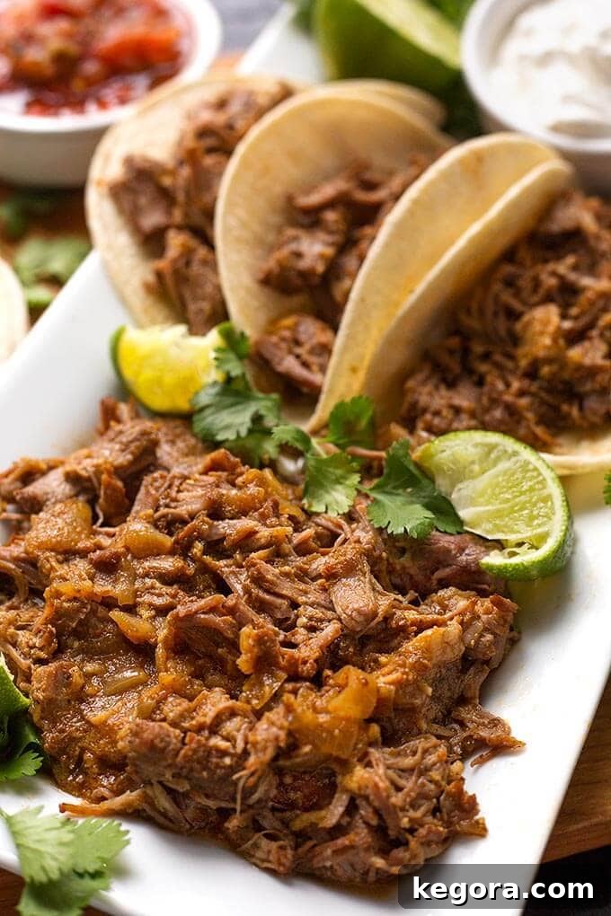 15 Instant Pot Hacks for Effortless Cooking 6 Instant Pot Pork Carnitas in taco shells on a white platter