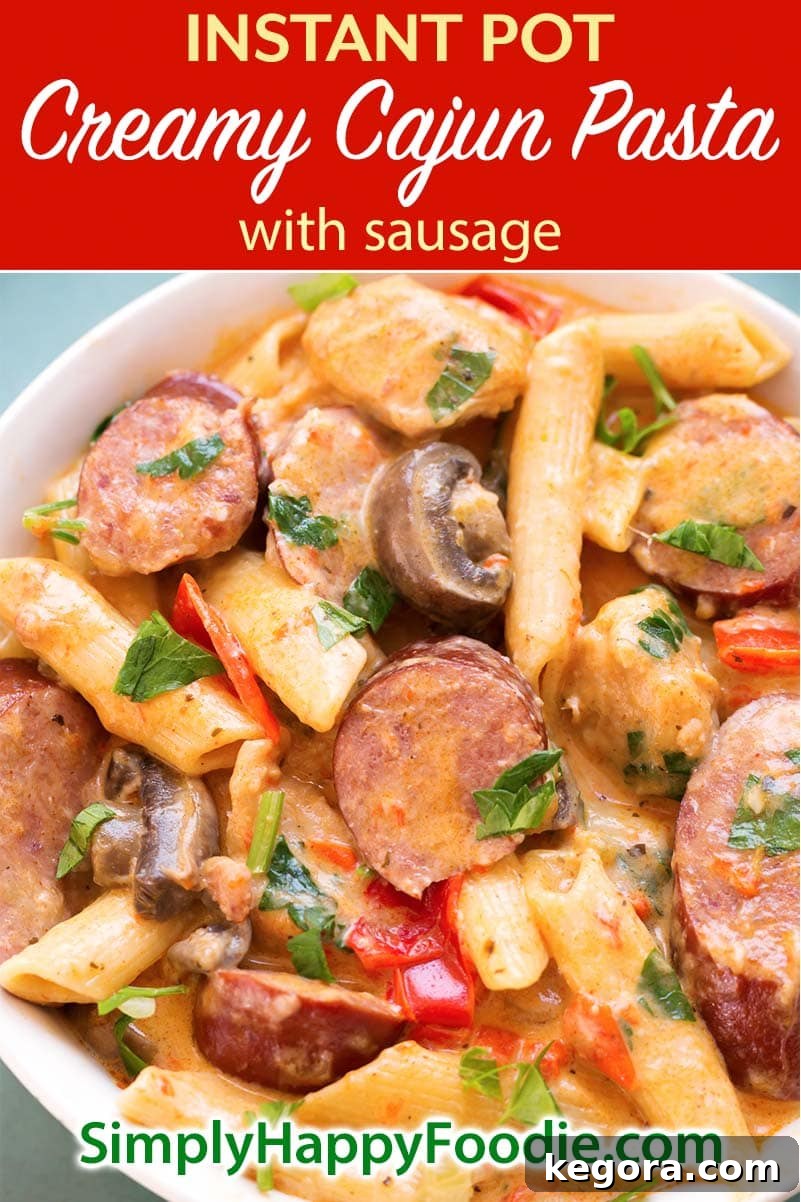 Instant Pot Creamy Cajun Pasta with Sausage is a super delicious meal with penne pasta, smoky kielbasa, red bell pepper, mushrooms, and a creamy sauce. Pressure cooker Creamy Cajun Pasta with Sausage is a one pot meal! Instant Pot recipes by simplyhappyfoodie.com #instantpotpasta #instantpotcajunpasta