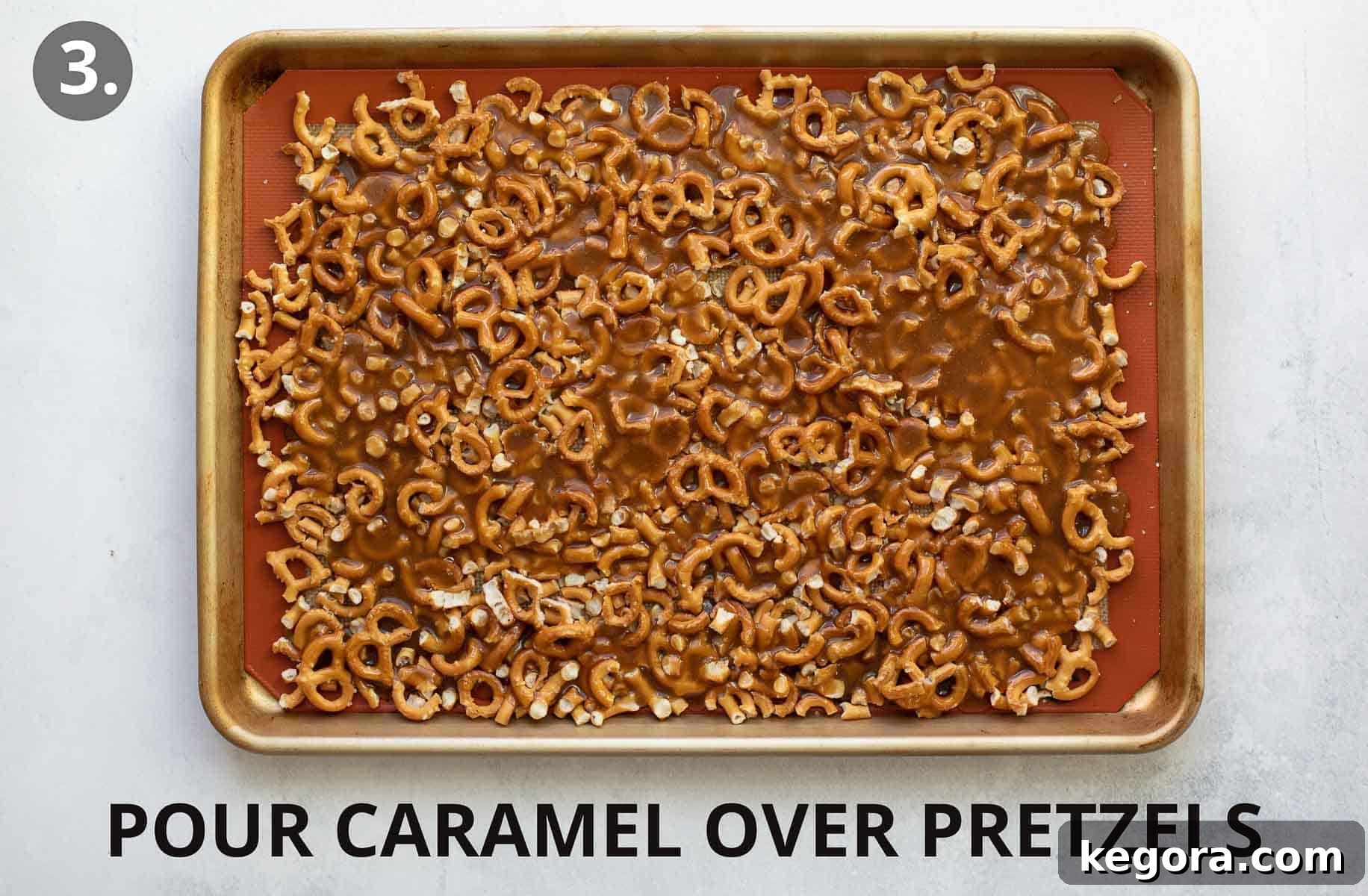 Festive Gluten-Free Pretzel Delights 6 Hot caramel mixture being poured over the pretzel layer on a baking sheet