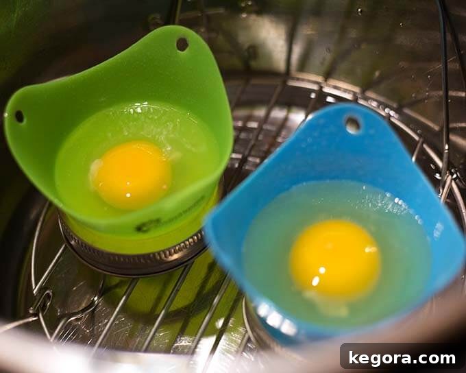 Two molds with egg without shell on trivet in pressure cooker pot