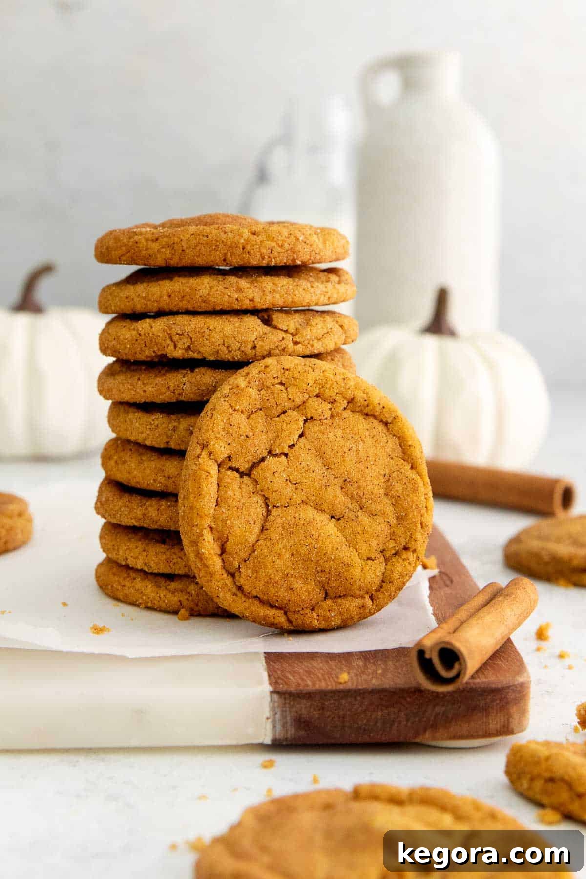 Close-up of freshly baked chewy gluten-free pumpkin snickerdoodles, perfectly golden with cinnamon-sugar coating.