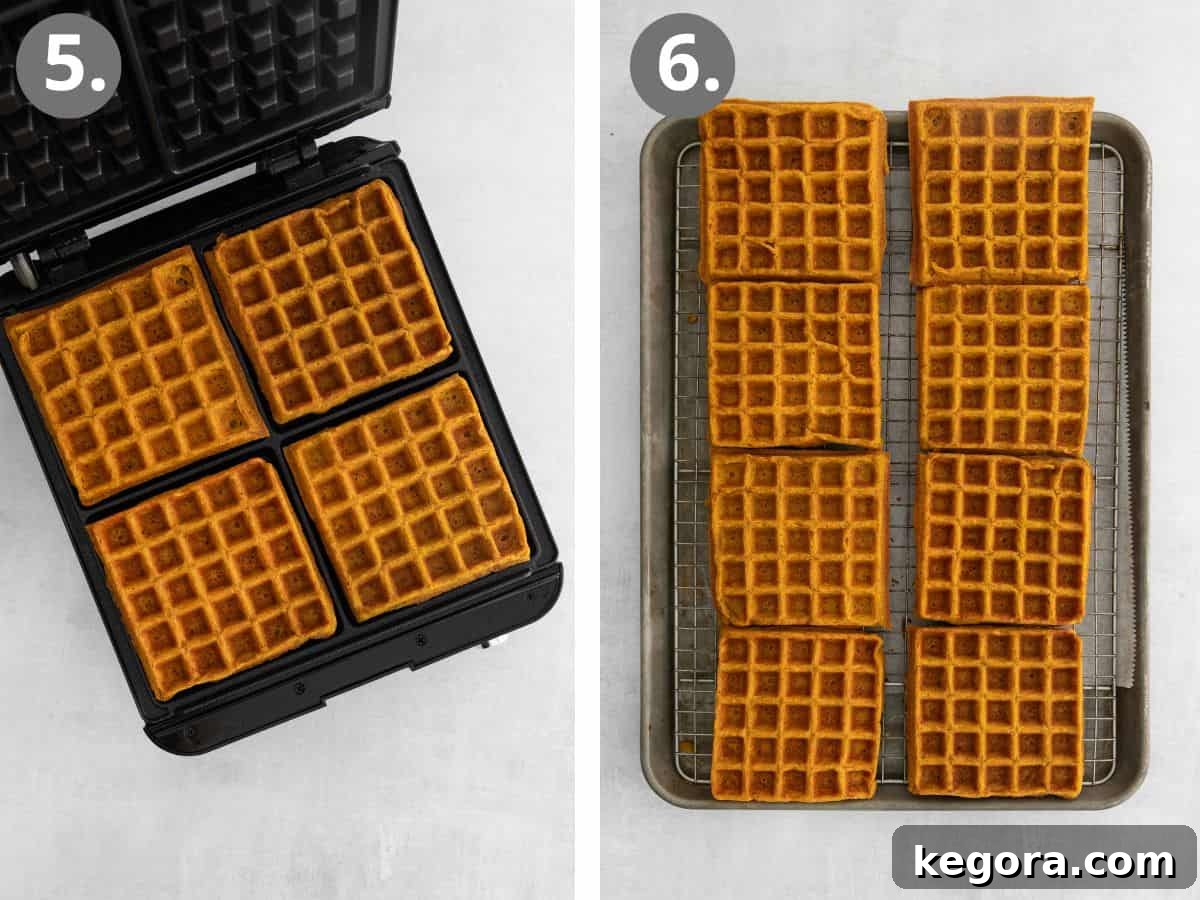 Fluffy Gluten-Free Pumpkin Waffles 6 A close-up view of golden-brown pumpkin waffles cooking in a waffle iron, showcasing the crispy texture.