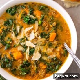 Instant Pot Sweet Potato Sausage and Kale Soup is a hearty, but not heavy soup with a ton of flavor. It is easy to make, and so very delicious, and even healthy! simplyhappyfoodie.com #instantpotrecipes #instantpotsweetpotatosausagekalesoup #instantpotsoup #pressurecookersoup