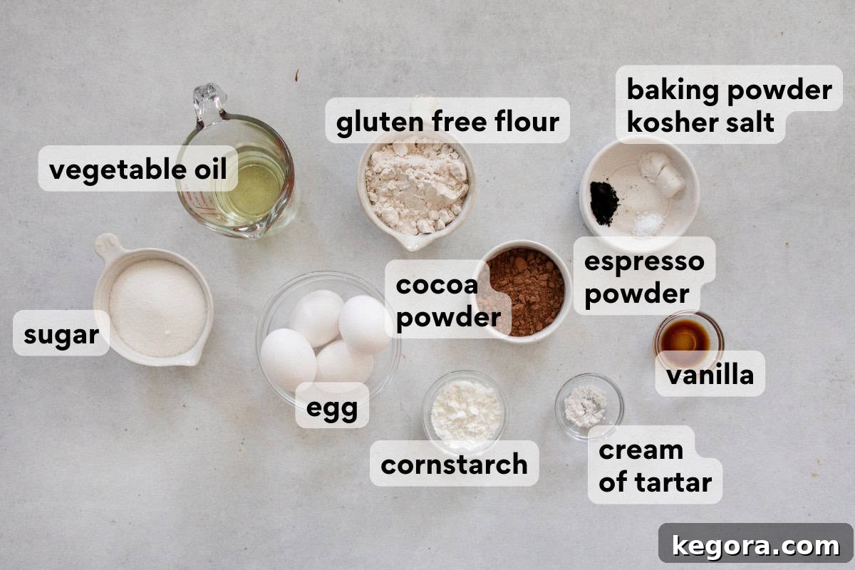 Gluten-Free Holiday Log Delight 4 An array of ingredients for gluten-free chocolate yule log cake, including gluten-free flour, cocoa powder, and eggs, arranged on a countertop.