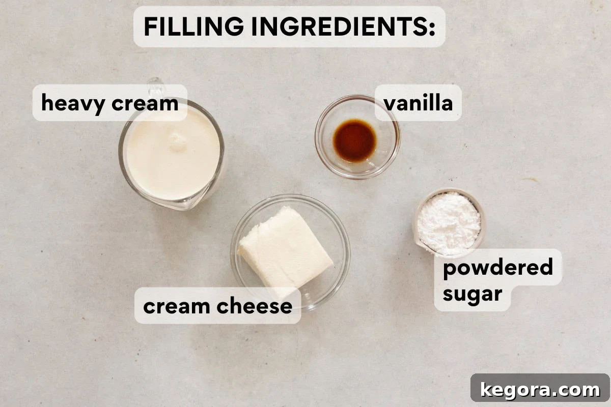 Gluten-Free Holiday Log Delight 5 Ingredients for the gluten-free chocolate yule log filling, including cream cheese and heavy cream, laid out on a kitchen surface.