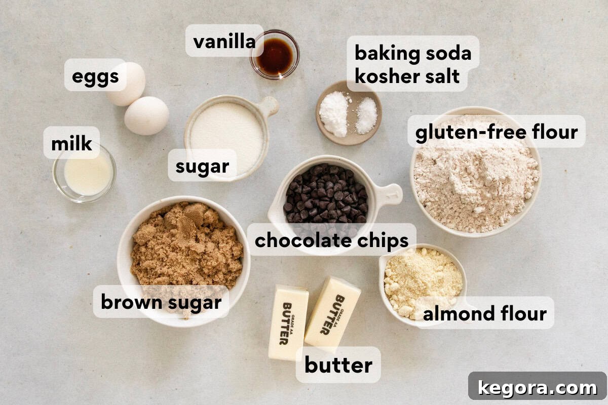 Various baking ingredients including gluten-free flour, almond flour, milk, and eggs arranged on a countertop, ready for cookie preparation.