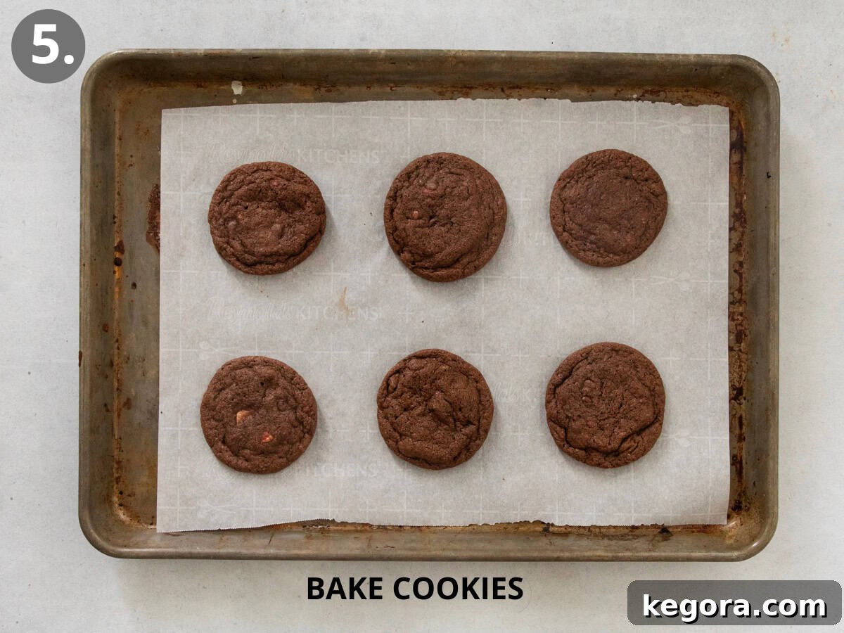Heavenly Gluten-Free Peppermint Frosted Chocolate Cookies 8 Gluten-free peppermint frosted chocolate cookies baked on a cookie sheet