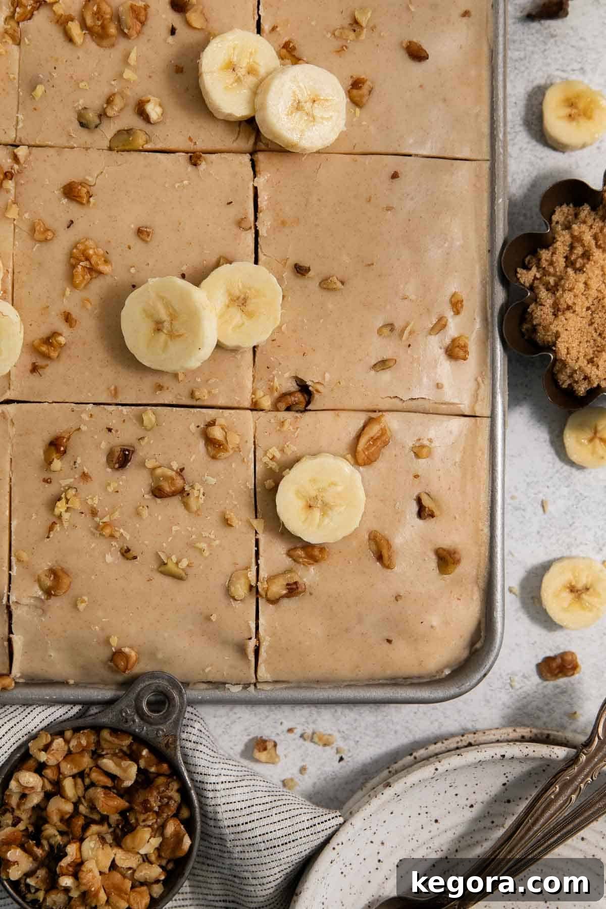 An overhead view of gluten-free brown butter banana bars in a jelly roll pan