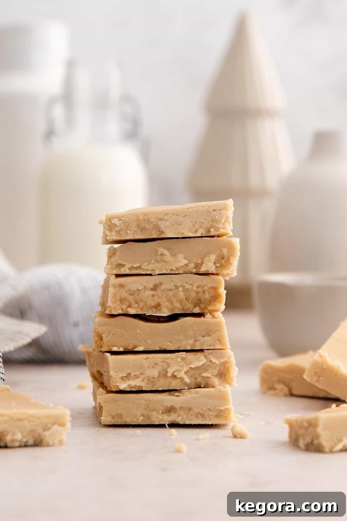Golden Vanilla Penuche Fudge 3 Pieces of creamy penuche vanilla fudge stacked in an inviting tower, showcasing its rich texture.